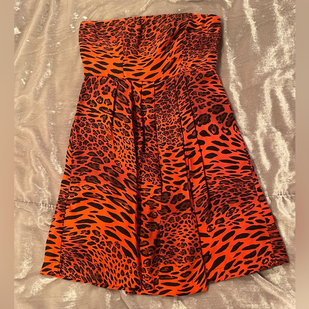 100% silk pink and black leopard print strapless mini dress. Like new!